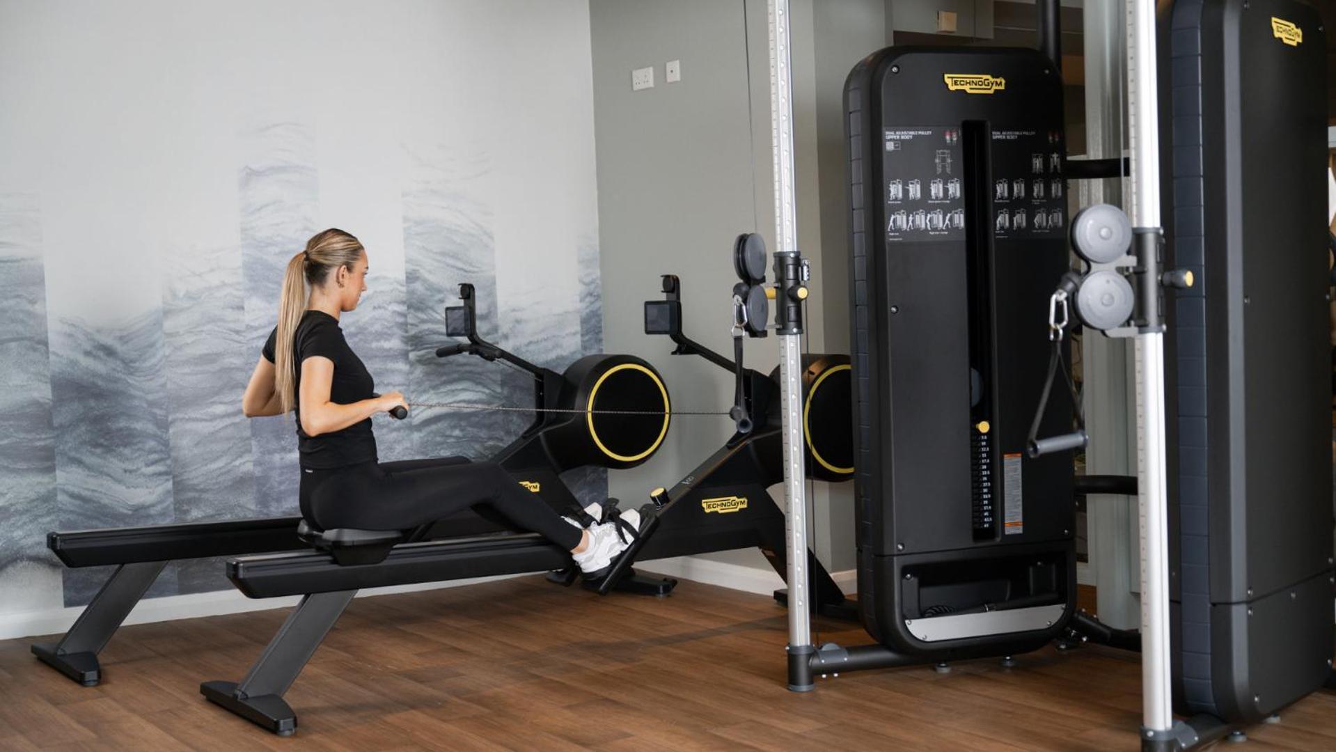 The Culloden Estate And Spa Holywood  Zewnętrze zdjęcie A woman using a rowing machine