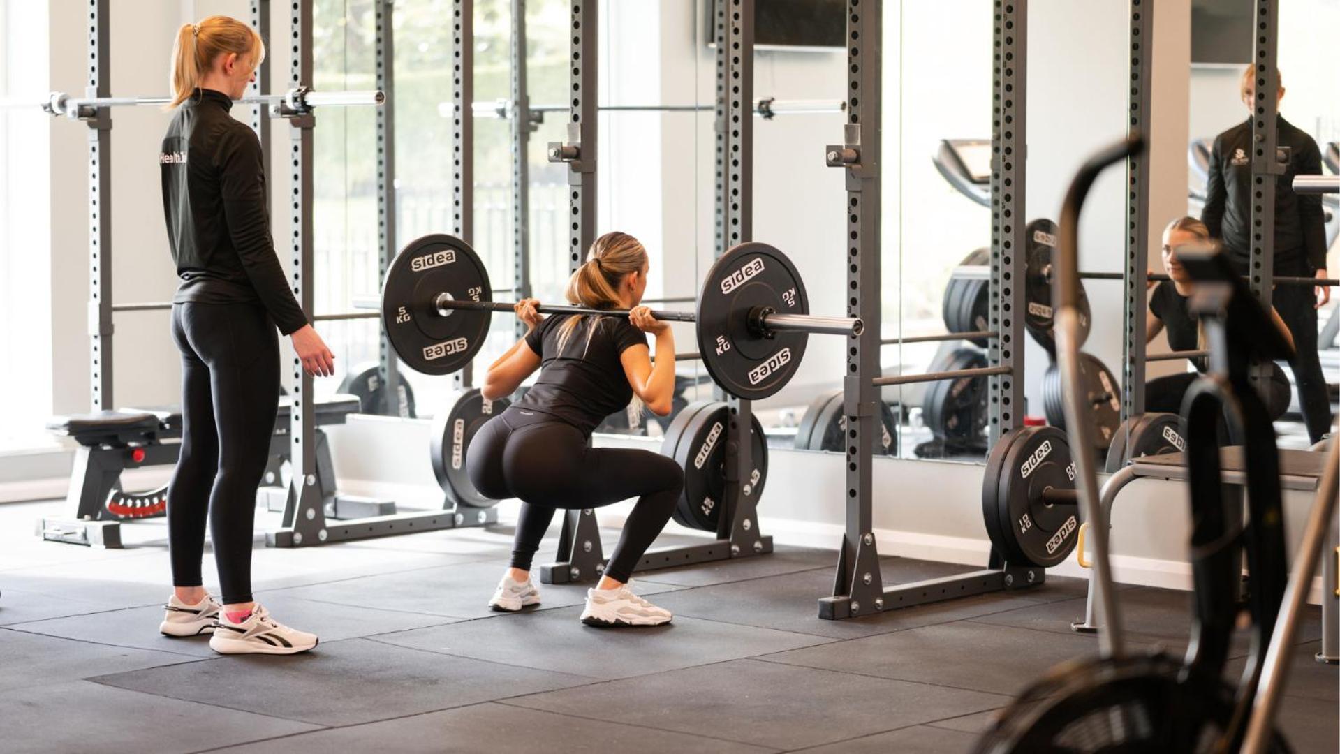 The Culloden Estate And Spa Holywood  Zewnętrze zdjęcie A woman performing a back squat with a barbell
